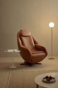 Ceragem Pause M6 in brown with a floor lamp
