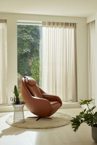 Ceragem Pause M6 in brown by a window