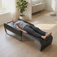 Man relaxing on the Ceragem Master V7 in a bright living room