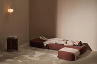 Lying on the Ceragem Master S4 in brown